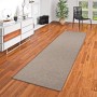 Brauner Snapstyle Teppichläufer Bentzon (80x240cm) auf Holzboden.