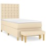 Cremefarbenes Boxspringbett 90x190 cm mit Matratze und Bank.