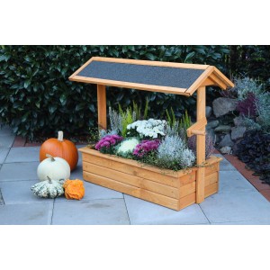 Promadino Pflanzkasten Zierbrunnen Chiemsee aus Kiefernholz, bepflanzt mit Blumen und Kürbissen.
