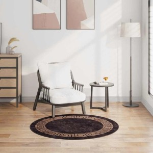 Runder, waschbarer Teppich in Schwarz und Gold (Ø 120 cm) mit rutschfester Rückseite.