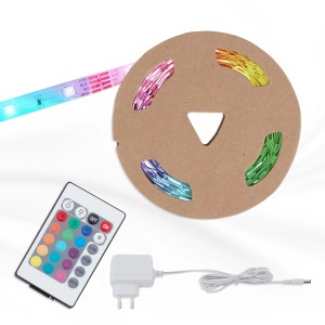 Brilo RGB-LED Flexband 3m mit Fernbedienung, Netzteil und aufgerollt auf einer Pappspule.