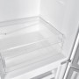 Innenansicht PKM Kühl-Gefrierkombination mit transparenter Gemüseschublade.