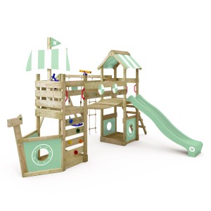 Wickey Spielturm StormFlyer mit Rutsche in Pastellgrün, Kletterwand, Schaukel und Sandkasten.