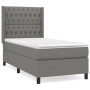 Dunkelgraues Boxspringbett 90x190 cm mit Stoffbezug, Matratze und Kopfteil.