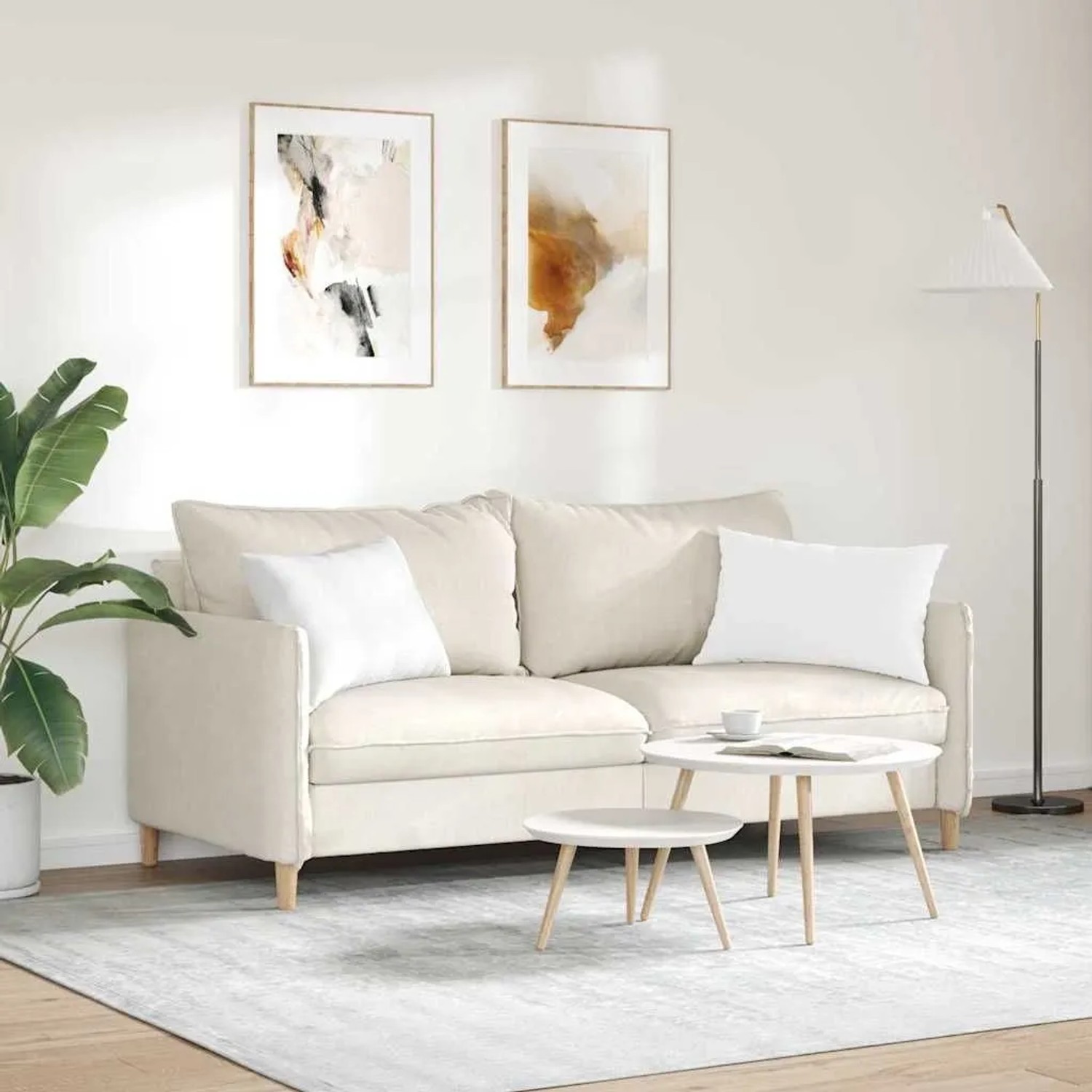 Zwei weiße vidaXL Sofakissen (60x40 cm) aus Stoff auf einem Sofa in einem Wohnzimmer.
