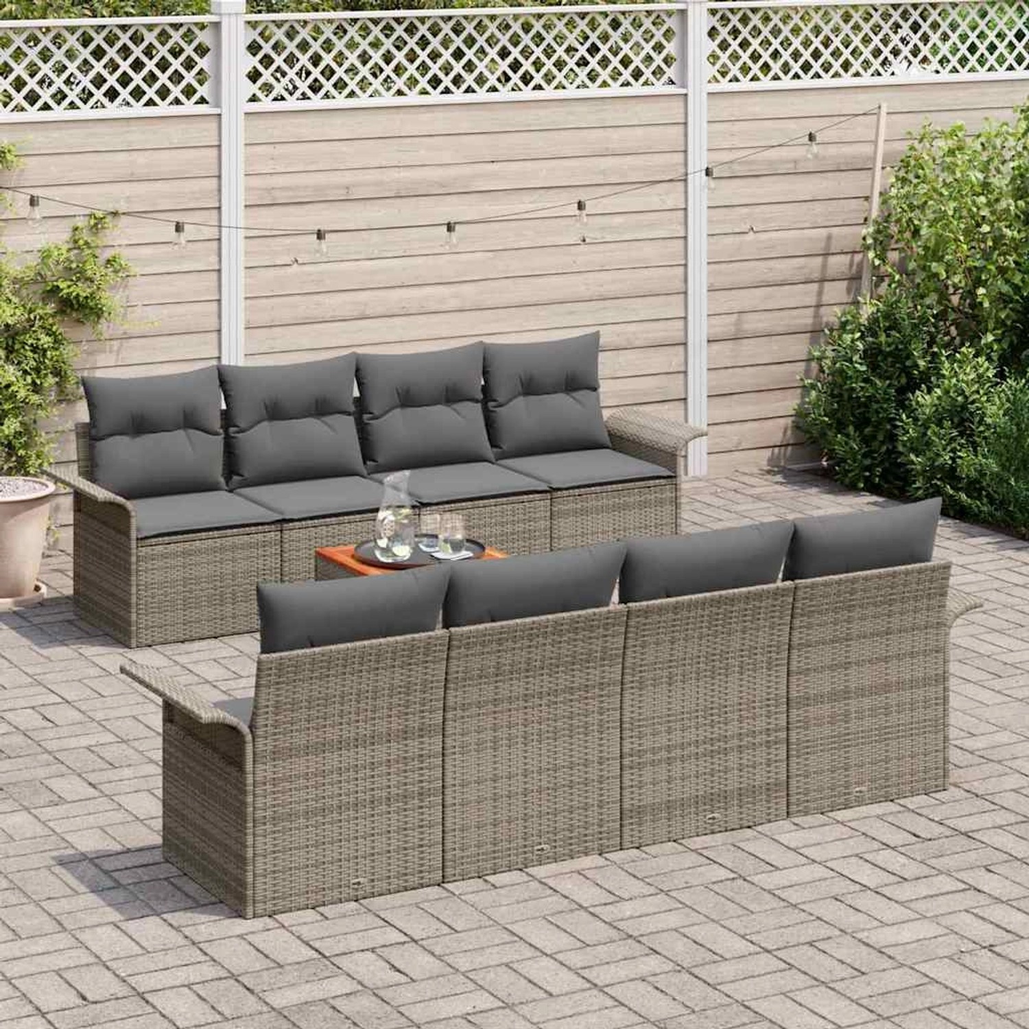 Graues 9-teiliges vidaXL Garten-Sofa-Set aus Poly Rattan mit Tisch und grauen Auflagen.
