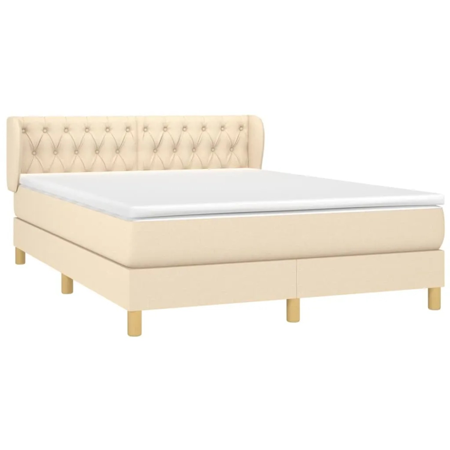 Cremefarbenes Boxspringbett 140x200 cm mit Matratze und gestepptem Kopfteil.