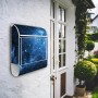 Weißer Banjado Design Briefkasten mit Universum Motiv und Zeitungsfach an Hauswand.