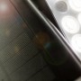 Detailaufnahme der schwarzen Lutec LED-Solarleuchte Tuda mit Solarpanel und LED-Leuchtköpfen.