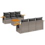 Graue 7-teilige Garten-Sofagarnitur aus Polyrattan mit Tisch und Kissen.