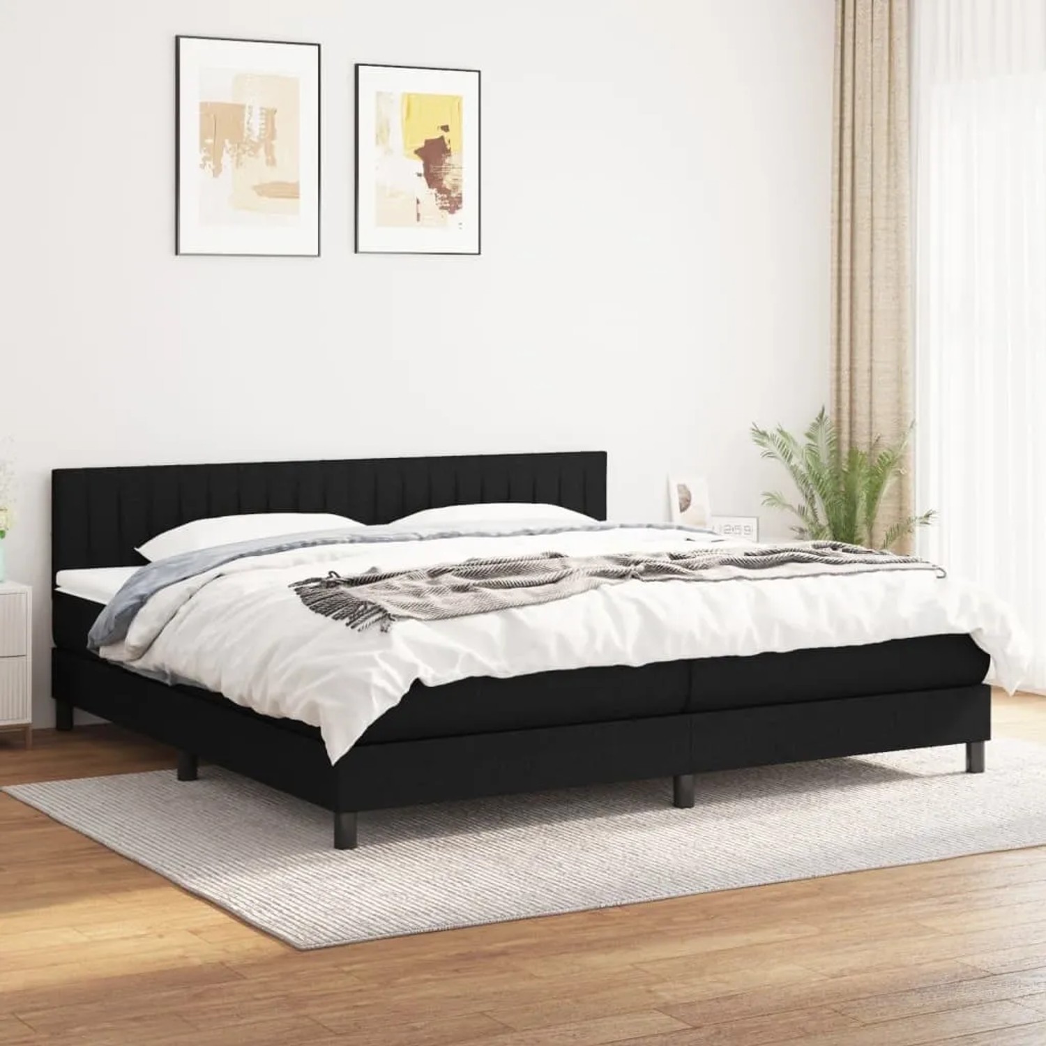 Schwarzes vidaXL Boxspringbett (200x200 cm) mit Matratze und Kopfteil im Schlafzimmer.