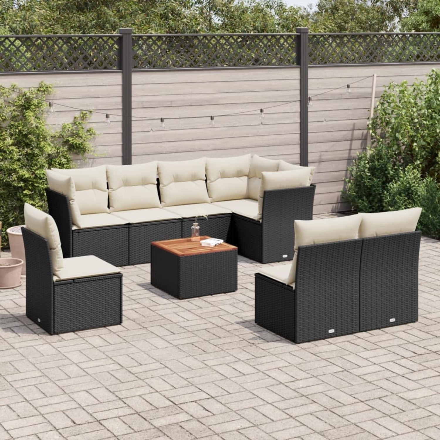 Schwarze 9-tlg. vidaXL Garten-Sofagarnitur aus Polyrattan mit cremefarbenen Kissen.