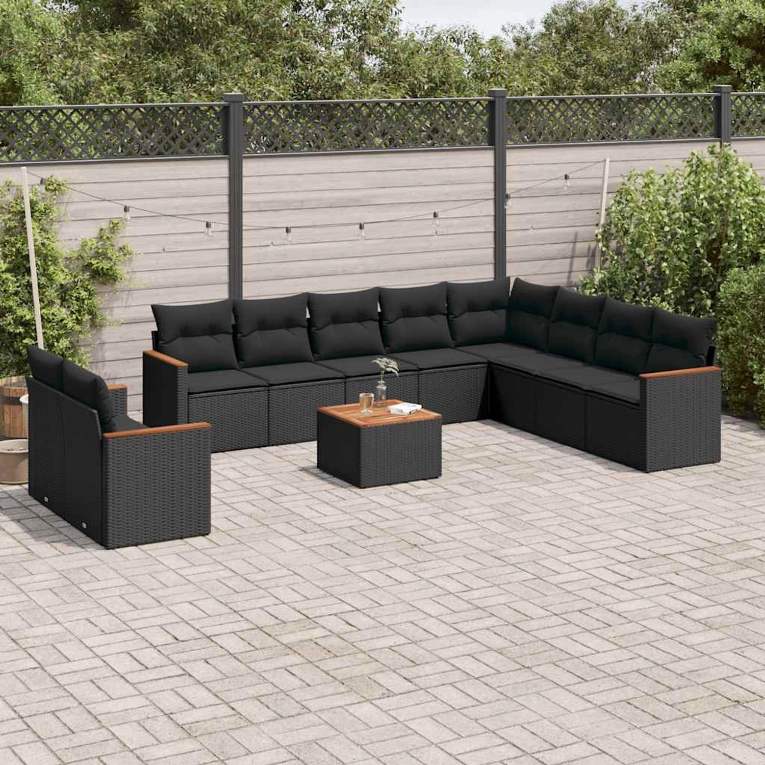 Schwarze 11-tlg. vidaXL Garten-Sofagarnitur aus Poly Rattan mit Kissen und Tisch.