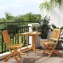 Klappbare 3-tlg. Garten-Essgruppe aus Akazienholz auf Balkon mit Tisch und zwei Stühlen.