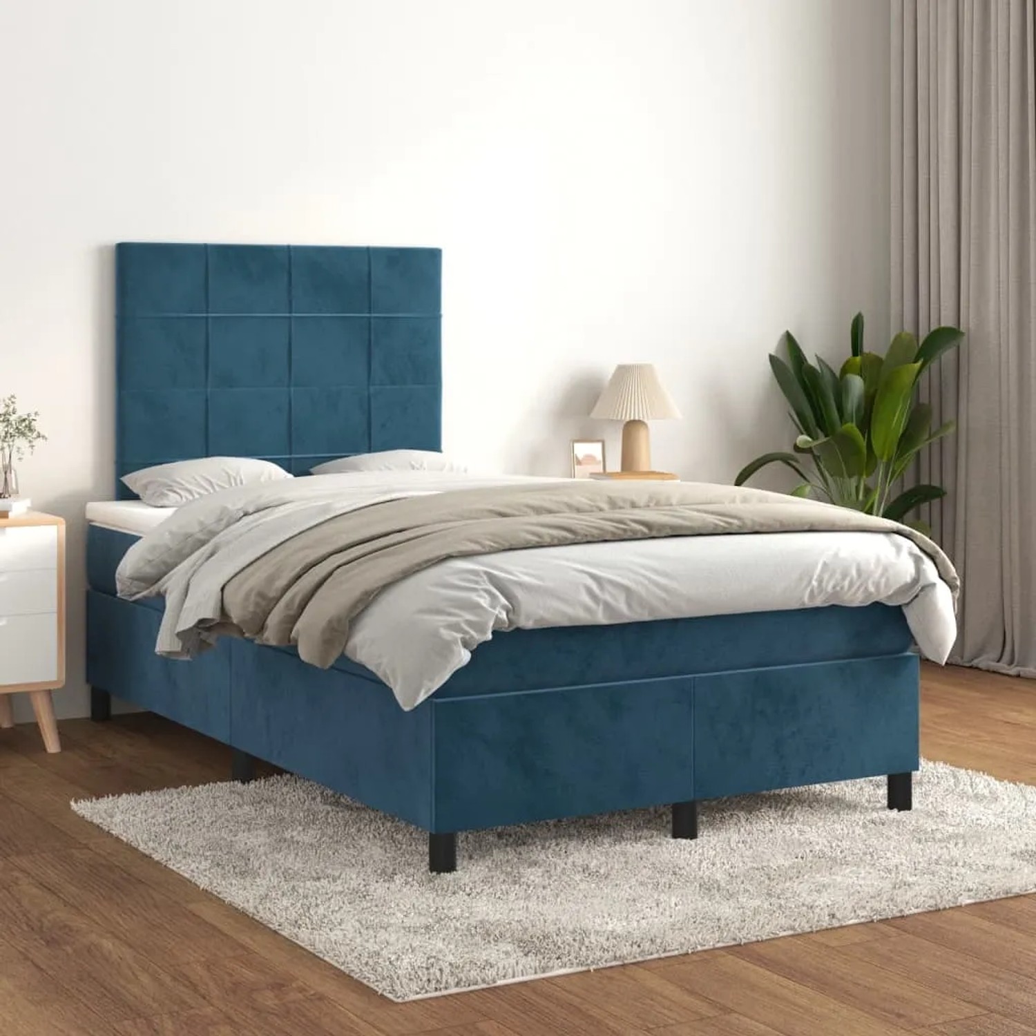 Dunkelblaues vidaXL Boxspringbett (120x200 cm) mit Samtbezug, Matratze und Kopfteil.