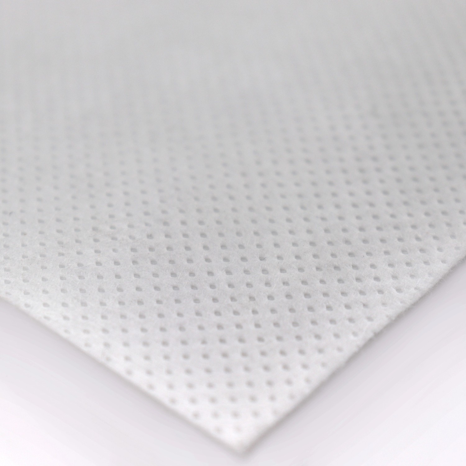 Detailaufnahme eines weißen Aquagart Unkrautvlies (150g/m²) mit feiner Punktstruktur.