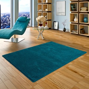 Petrolfarbener Snapstyle Hochflor Shaggy Teppich Palace, 133x133cm, im Wohnraum.
