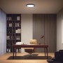 Schwarze Philips Hue Aurelle LED-Panelleuchte (Ø 39,5 cm) im modernen Arbeitszimmer.