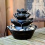 Dobar Design Zimmerbrunnen in Felsen-Optik, schwarz, mit Deko-Steinen für entspannende Atmosphäre.