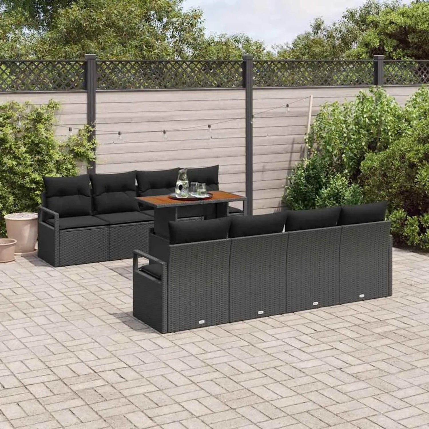 Schwarzes 9-teiliges vidaXL Garten-Sofa-Set aus Poly Rattan mit Tisch und Stauraum.