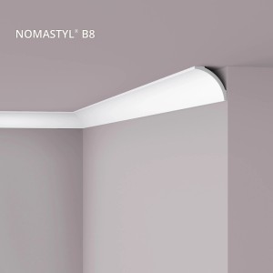 Weiße NOEL & MARQUET NMC B8 Eckleiste als Zierleiste an einer Wand montiert.