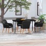 Schwarze 5-tlg. Garten Essgruppe mit Rattan-Stühlen und Tisch mit Glasplatte.