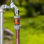 Gardena Schlauchstück 19 mm (3/4) am Wasserhahn mit Gartenschlauch.