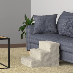 Beige Juskys Haustiertreppe Timmy mit 3 Stufen vor blauem Sofa. Ideal als Hunderampe & Hundetreppe.