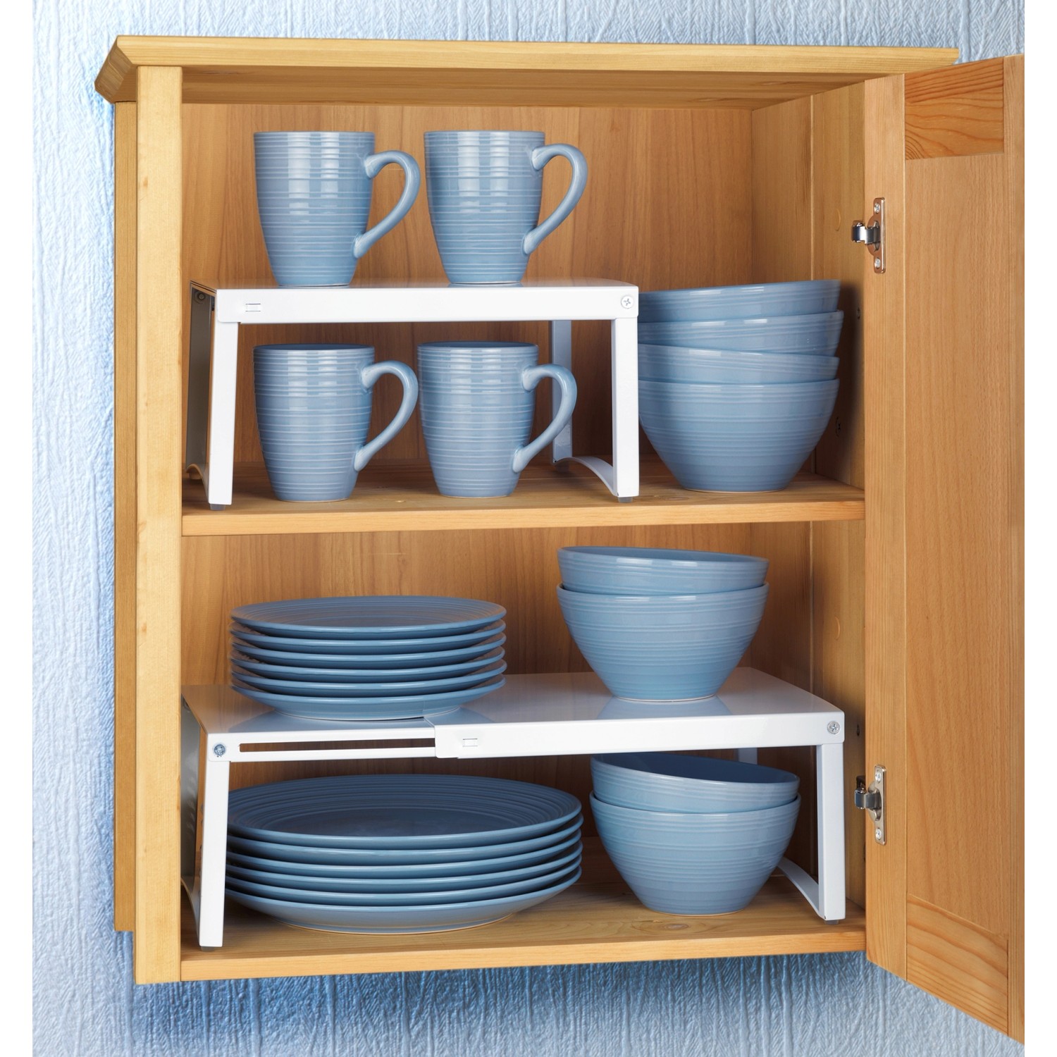 Wenko Teleskop-Schrankeinsatz im Küchenschrank mit Geschirr.