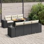 Schwarze 7-tlg. Garten-Sofagarnitur aus Rattan mit Tisch und cremefarbenen Kissen.