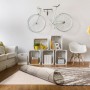 Beige Luxor Living Teppichunterlage unter gemustertem Teppich auf Holzboden. Rutschschutz für Teppiche.