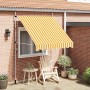 Ausgezogene, orange-weiß gestreifte Handmarkise vidaXL (200 cm) am Haus.
