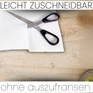 Weiße Sensalux Vlies-Tischdecke auf Rolle mit Schere, leicht zuschneidbar.