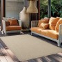 Beiger Ayyildiz Outdoor-Teppich Giza 80x150 cm in Sisal-Optik auf einer Terrasse.