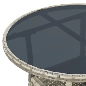 Runder, grauer Gartentisch Yoro aus Polyrattan mit Glasplatte, 60 cm Durchmesser.