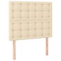 Cremefarbenes Boxspringbett Kopfteil mit Knopfheftung, Stoffbezug.