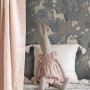 ESTAhome Vliestapete Einhörner graublau im Kinderzimmer mit Stofftier und Kissen.