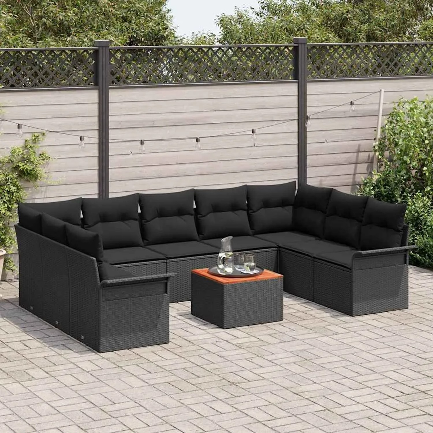 Schwarzes 10-teiliges Garten-Sofa-Set aus Poly Rattan mit Tisch und Stauraum.