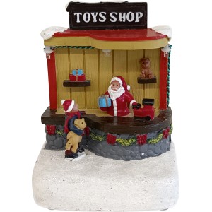 OBI Weihnachtsdorf Figur: beleuchteter Spielzeugladen mit Weihnachtsmann, Kind und Schnee. Mehrfarbige Weihnachtsdekoration aus Polyresin.