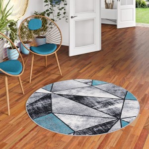 Runder, blauer Designer Teppich "Brilliant Magic" von Pergamon mit geometrischem Muster.
