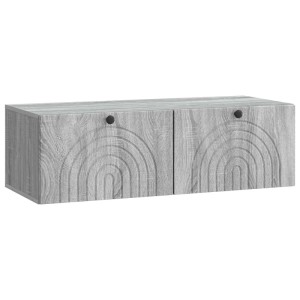 Wandmontierter TV-Schrank in Grau-Sonoma mit zwei Türen und dekorativem Rillenmuster.