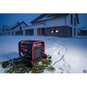 Roter Einhell Stromerzeuger TC-PG 3100 im Schnee vor einem Haus. Mobiler Benzin-Generator für Notstrom im Winter.