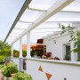 Terrassenüberdachung mit weiß-opalen 16 mm Hohlkammerplatten als Kunststoffbedachung.