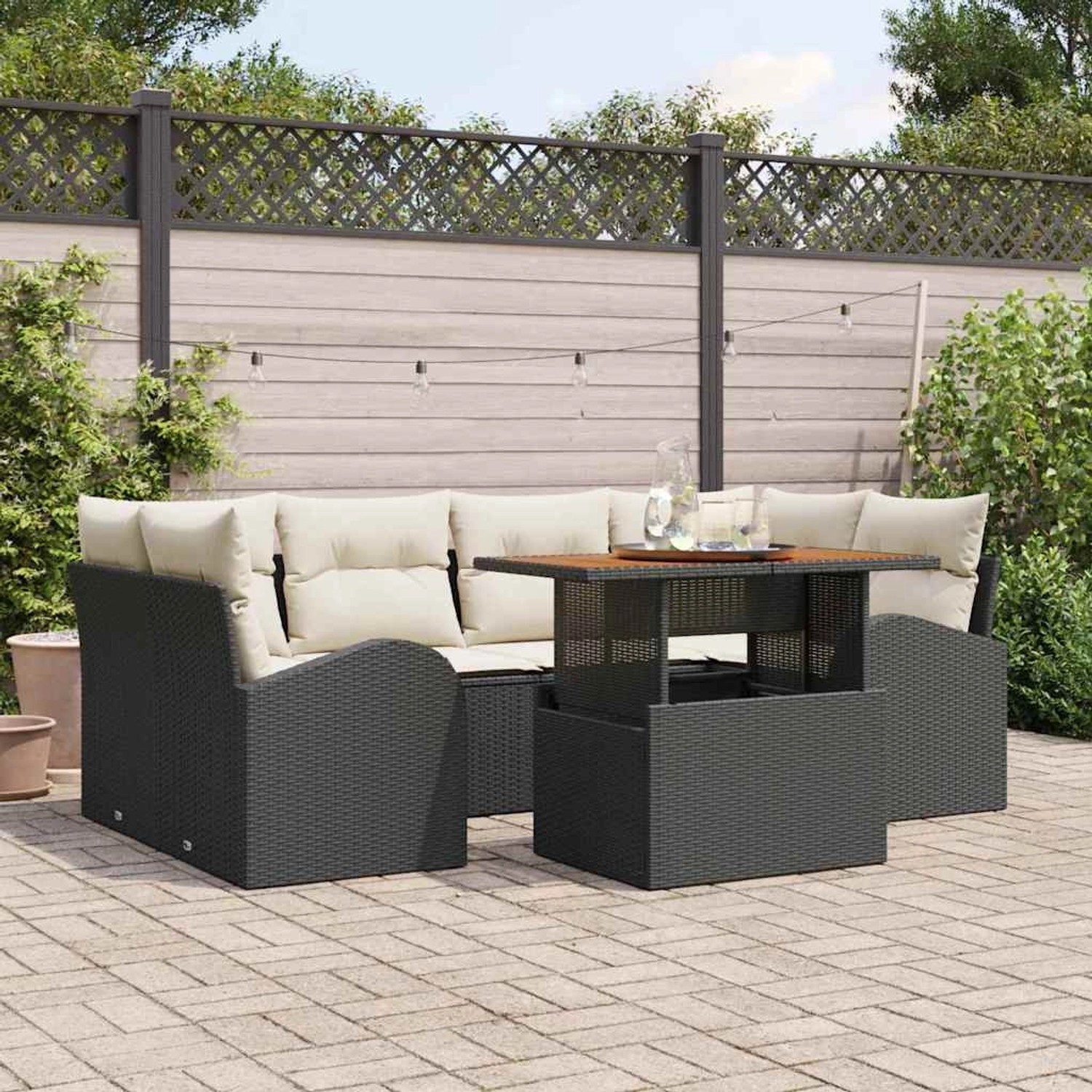 Schwarzes 7-teiliges vidaXL Garten-Sofa-Set aus Poly Rattan mit Stauraum und Tisch.