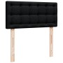 Schwarzes vidaXL Boxspringbett Kopfteil mit Knopfleiste und Holzfüßen.