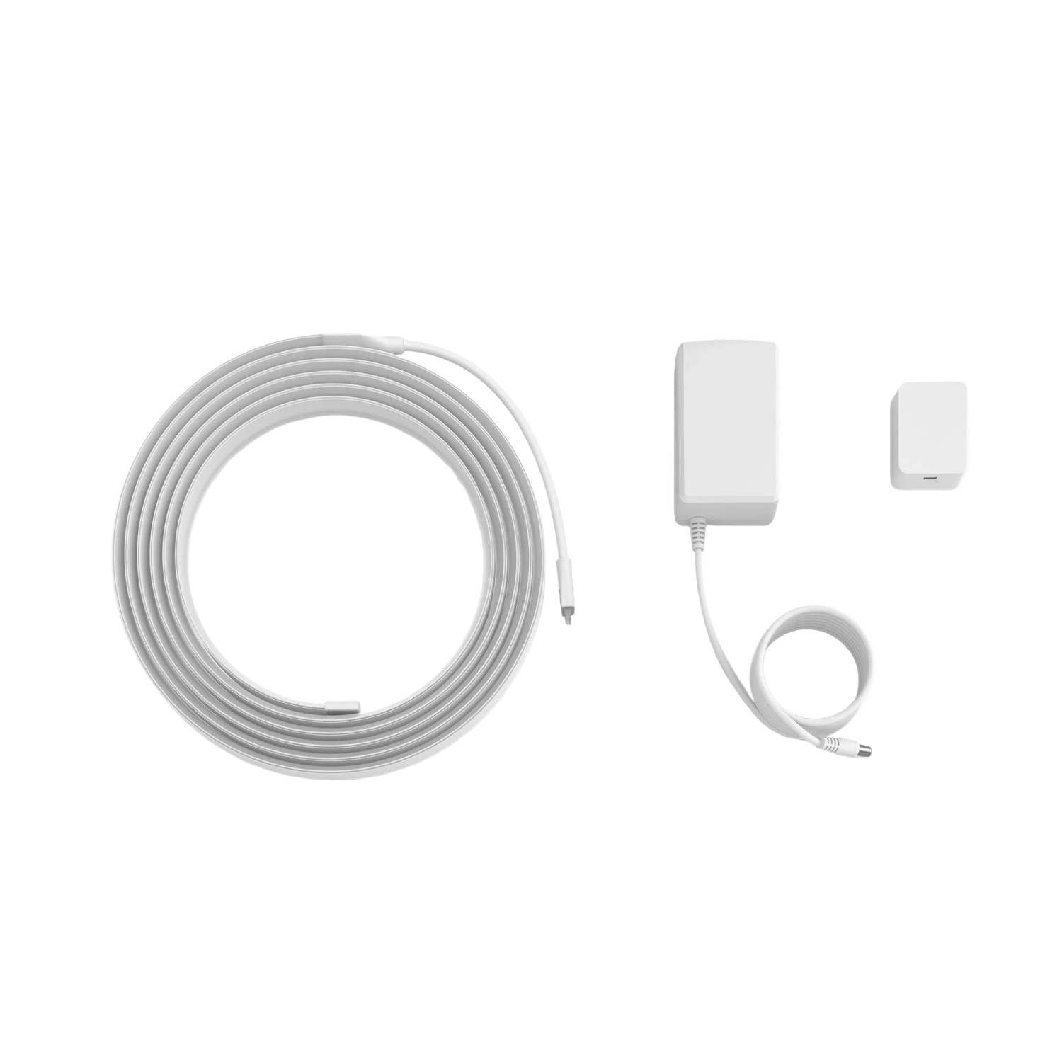 Philips Hue Lightstrip Flux UltraBright 3m, aufgerollt mit Netzteil und Dimmschalter.