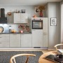Moderne pino Küchenzeile 280cm in Beton Weißgrau mit Elektrogeräten und Seitenschrank.