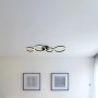 Schwarze Globo LED-Deckenleuchte Venosa, 88,5x33cm, mit vier Ringen im modernen Wohnzimmer.