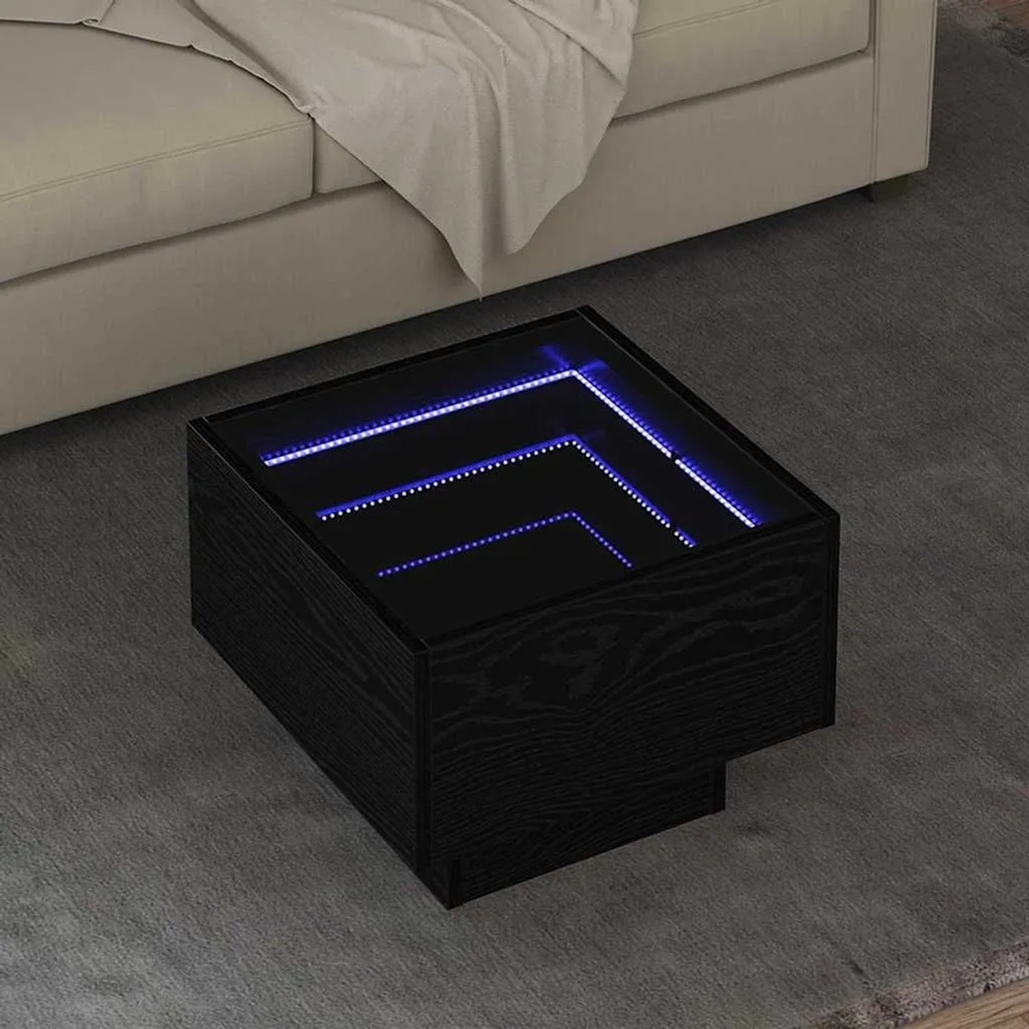 Quadratischer Couchtisch in Schwarz Eichen-Optik mit LED-Beleuchtung.