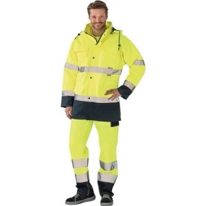 Mann trägt gelben Planam Warnschutzparka mit Reflexstreifen & marineblauer Hose. Wasserdichte, atmungsaktive Arbeitskleidung.